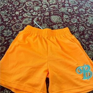 Bravest Studios Orange Shorts with Blue Logo